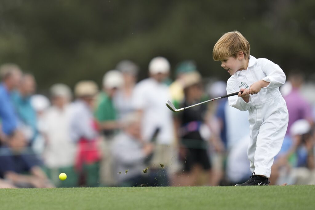 Peter Malnati's son Hatcher hits a tee shot on the first hole during the par-3 contest at the Masters golf tournament at Augusta National Golf Club Wednesday, April 10, 2024, in Augusta, GA. (AP Photo/Ashley Landis)