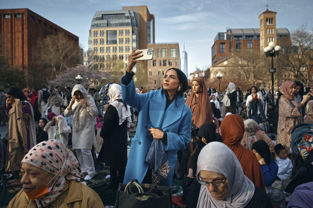 Muslims gather to perform an Eid al-Fitr prayer, marking the end of the fasting month of Ramadan at Washington Square Park on Wednesday, April 10, 2024, in New York. (AP Photo/Andres Kudacki)