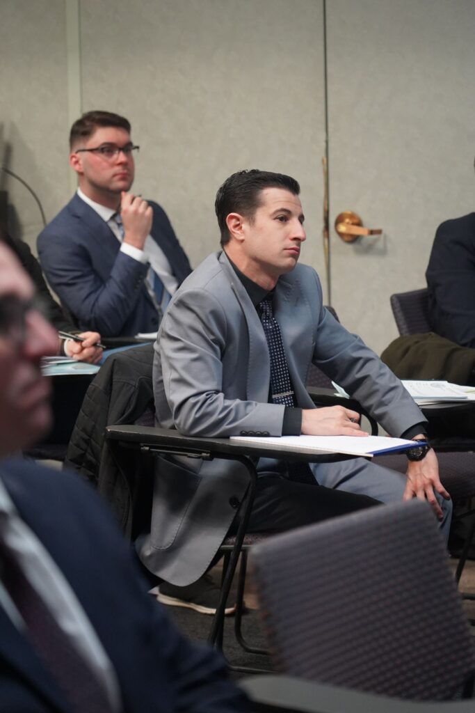 New Assistant District Attorney Joseph Doria listens attentively during a seminar led by Chief Diversity Officer Renee Gregory on fostering inclusivity within the prosecutor's office.