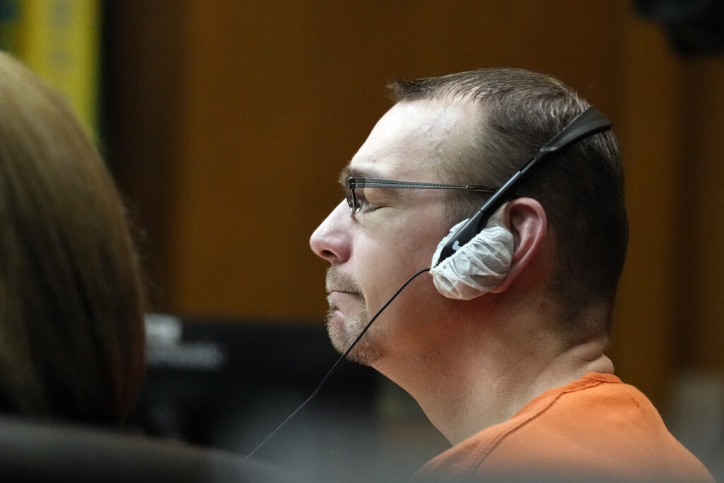 James Crumbley listens to a victim impact statement during his sentencing, Tuesday, April 9, 2024, in Pontiac, Mich. Jennifer and James Crumbley, the parents of a Michigan school shooter, were sentenced to at least 10 years in prison Tuesday for failing to take steps that could have prevented the killing of four students in 2021. (AP Photo/Carlos Osorio)