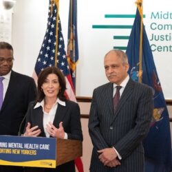 Gov. Kathy Hochul is joined by Chief Judge Rowan Wilson (right) and Jethro Antoine, the chief program officer at the Center for Justice Innovation, to announce more funding for the state's mental health courts. Photo by Don Pollard/Courtesy of Gov. Kathy Hochul’s Office.