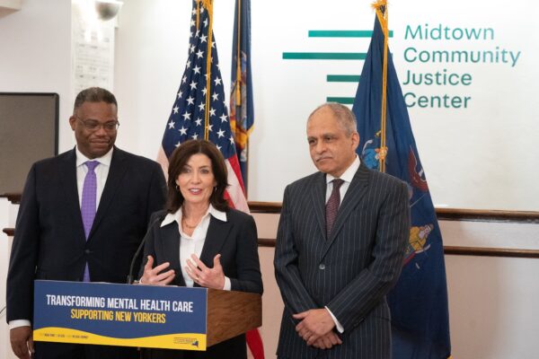 Gov. Kathy Hochul is joined by Chief Judge Rowan Wilson (right) and Jethro Antoine, the chief program officer at the Center for Justice Innovation, to announce more funding for the state's mental health courts. Photo by Don Pollard/Courtesy of Gov. Kathy Hochul’s Office.