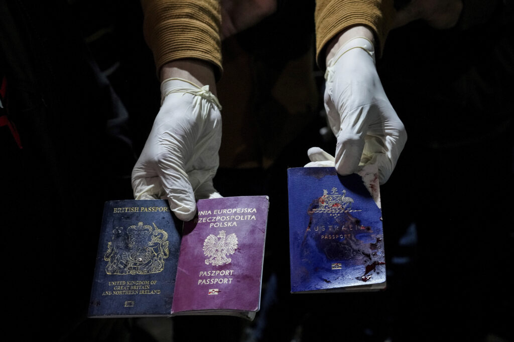 GAZA STRIP — The remnants of ongoing conflict: A man displays blood-stained British, Polish and Australian passports after an Israeli airstrike in Deir al-Balah, Gaza Strip, Monday, April 1, 2024. Gaza medical officials say an apparent Israeli airstrike killed four international aid workers with the World Central Kitchen charity and their Palestinian driver after they helped deliver food and other supplies to northern Gaza that had arrived hours earlier by ship.Photo: Abdel Kareem Hana/AP