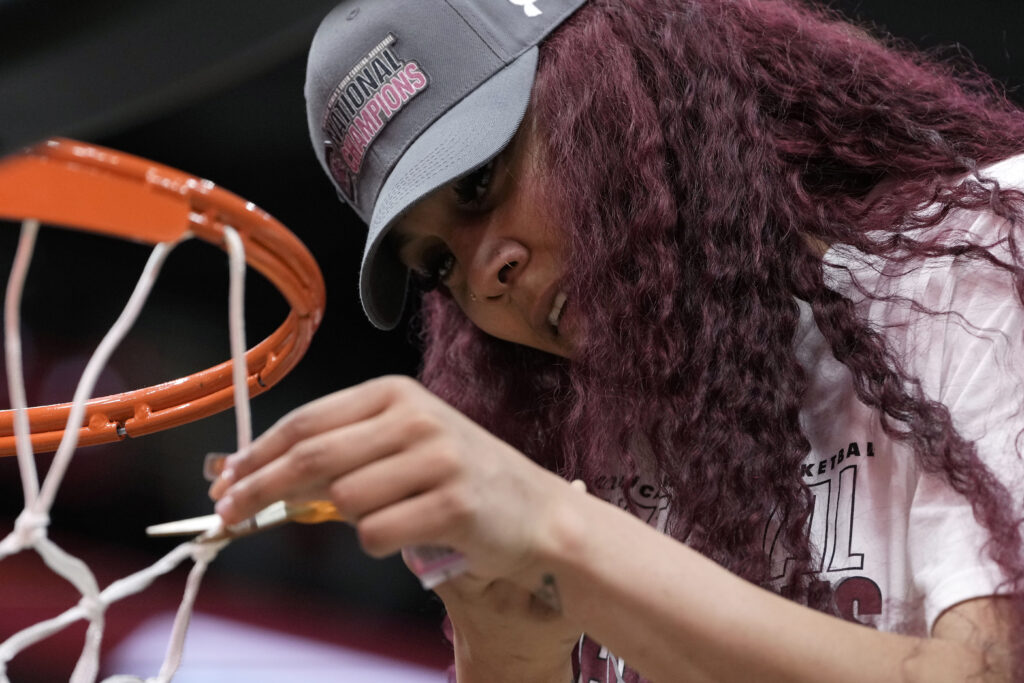 South Carolina center Kamilla Cardoso cuts down the net after the Final Four college basketball championship game against Iowa in the women's NCAA Tournament, Sunday, April 7, 2024, in Cleveland. South Carolina won 87-75. (AP Photo/Morry Gash)