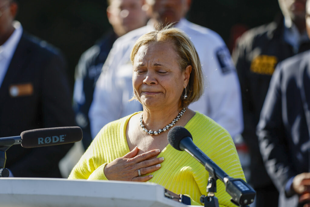 Charlotte Mayor Vi Lyles gets choked up as she speaks at a press conference regarding a shooting in Charlotte, N.C., Monday, April 29, 2024. Several officers on a U.S. Marshals Task Force serving a warrant for a felon wanted for possessing a firearm were killed and other officers were wounded in a shootout Monday in North Carolina, home, police said. (AP Photo/Nell Redmond)