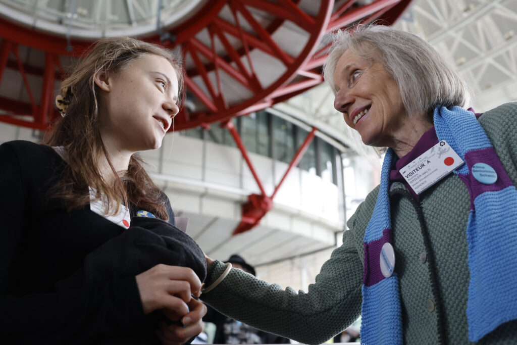 Swiss member of Senior Women for Climate Rosmarie Wydler-Walti, right, talks to Swedish climate activist Greta Thunberg after the European Court of Human Rights' ruling, Tuesday, April 9, 2024 in Strasbourg, eastern France. Europe's highest human rights court ruled that its member nations have an obligation to protect their citizens from the ill effects of climate change, but still threw out a high-profile case brought by six Portuguese youngsters aimed at forcing countries to reduce greenhouse gas emissions. (AP Photo/Jean-Francois Badias)