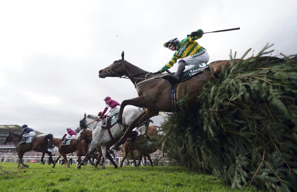 I Am Maximus, ridden by jockey P. Townend, competes to win the Randox Grand National Handicap Chase race on the third day of the Grand National Horse Racing meeting at Aintree racecourse, near Liverpool, England, Saturday, April 13, 2024. (Mike Egerton/PA via AP)