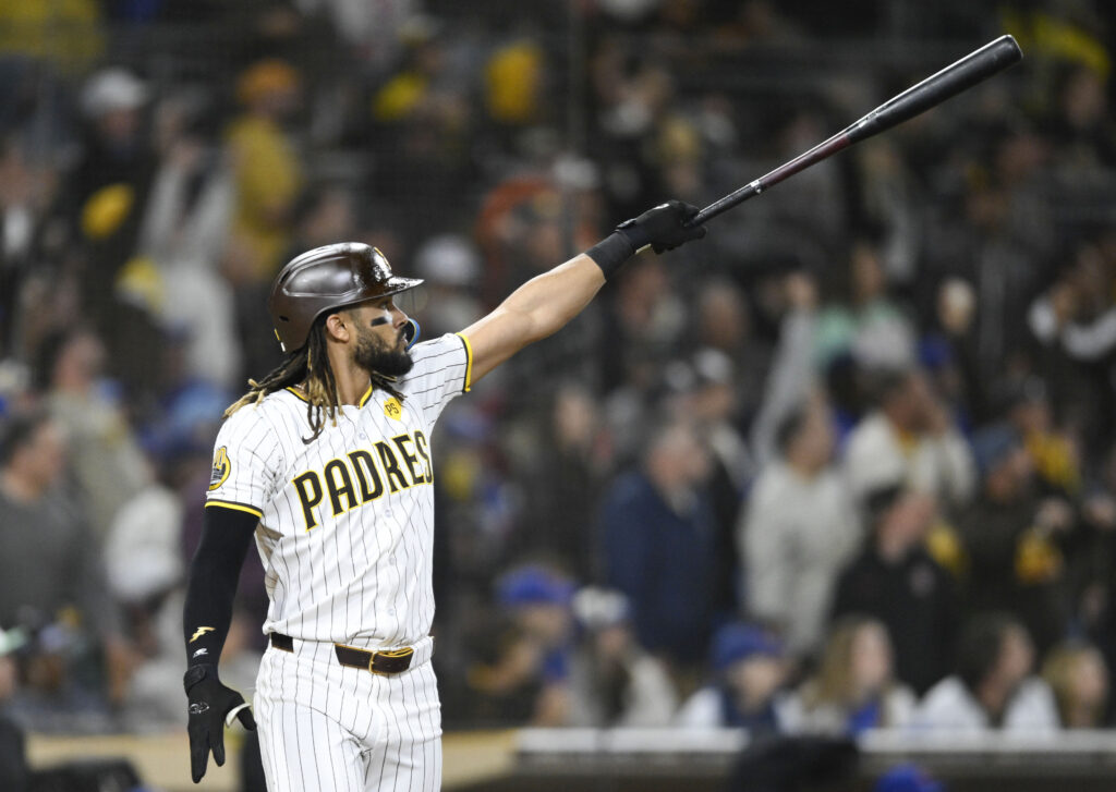 San Diego Padres' Fernando Tatis Jr. watches the flight of his two-run home run during the eighth inning of a baseball game against the Chicago Cubs, Monday, April 8, 2024, in San Diego. (AP Photo/Denis Poroy)