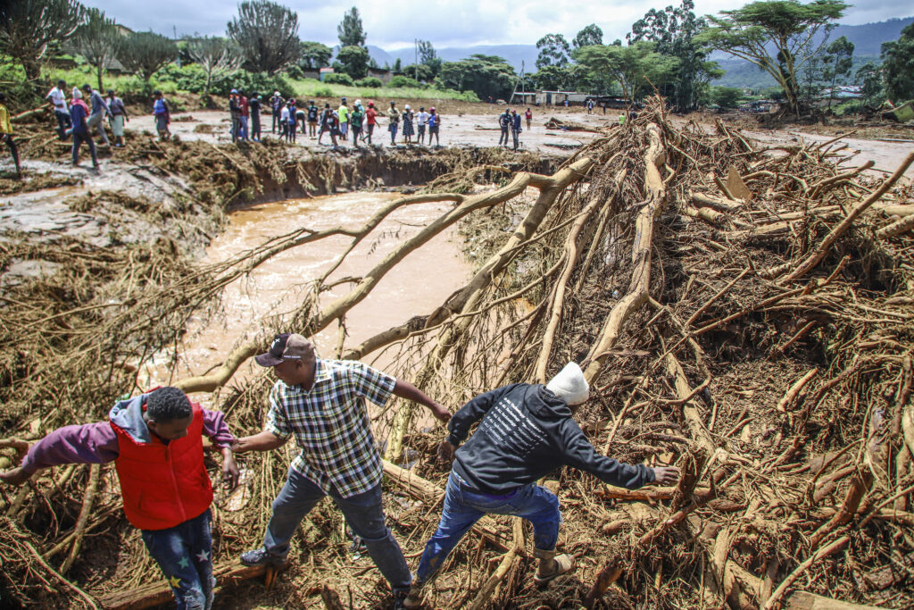People try to clear the area after a dam burst, in Kamuchiri Village Mai Mahiu, Nakuru County, Kenya, Monday, April 29, 2024. Kenya's Interior Ministry says at least 45 people have died and dozens are missing after a dam collapsed following heavy rains. (AP Photo/Patrick Ngugi)