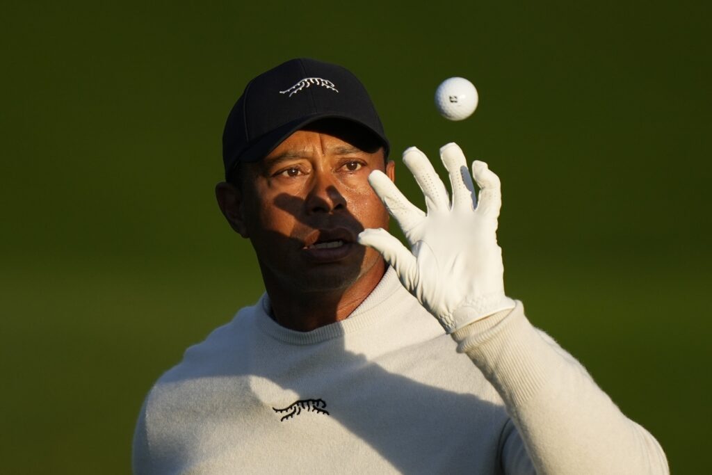 Tiger Woods catches a golf ball on the driving range during a practice round in preparation for the Masters golf tournament at Augusta National Golf Club Monday, April 8, 2024, in Augusta, Ga. (AP Photo/Matt Slocum)