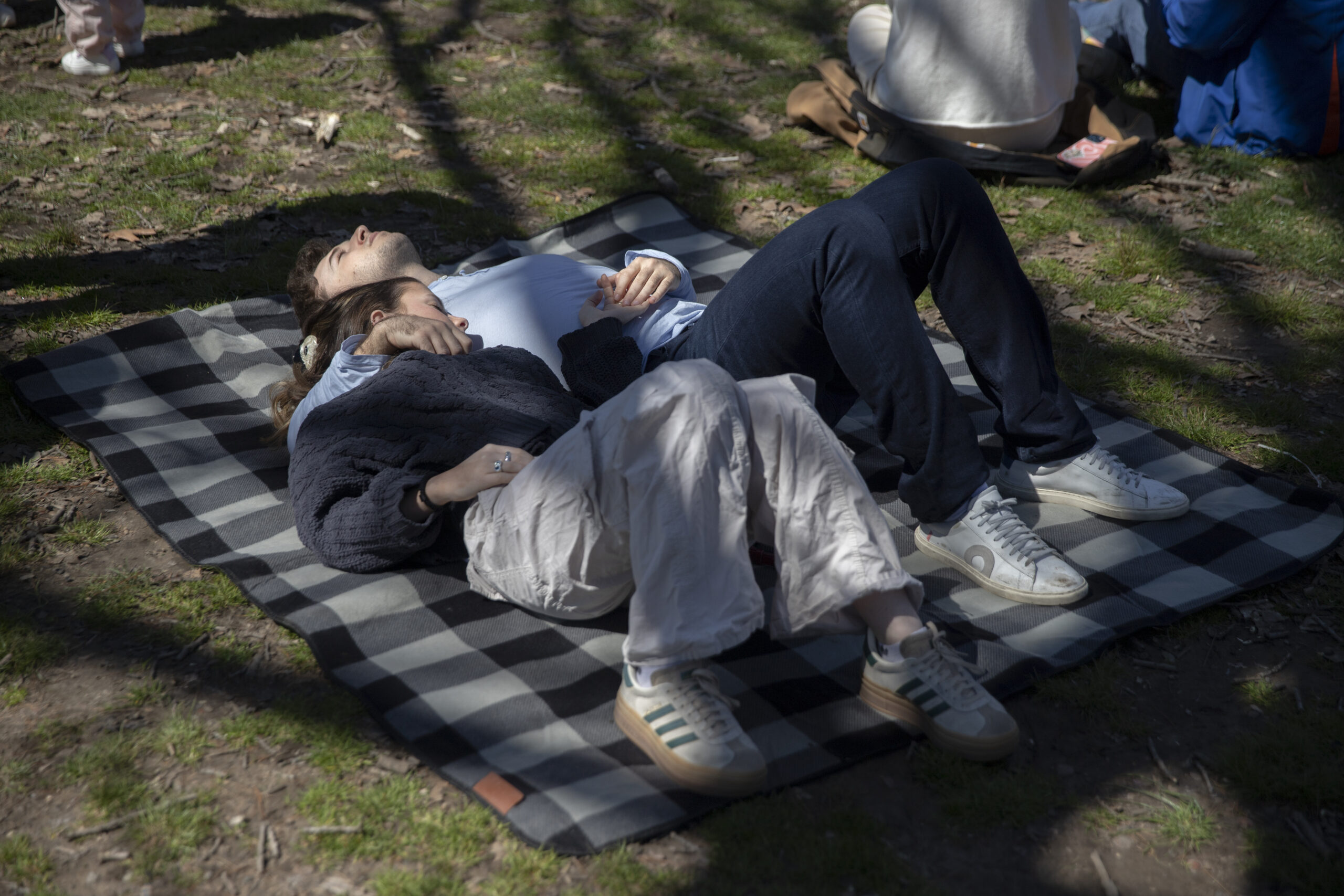 A young couple has eaten too much at Prospect Park Smorgasburg.