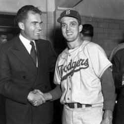 Sen. Richard Nixon, GOP Vice Presidential candidate, has a smile and a handshake for Brooklyn Dodgers hurler Carl Erskine after his eleven-inning, 6-5 win over the Yankees in the fifth World Series game at Yankee Stadium in New York City, October 5, 1952.