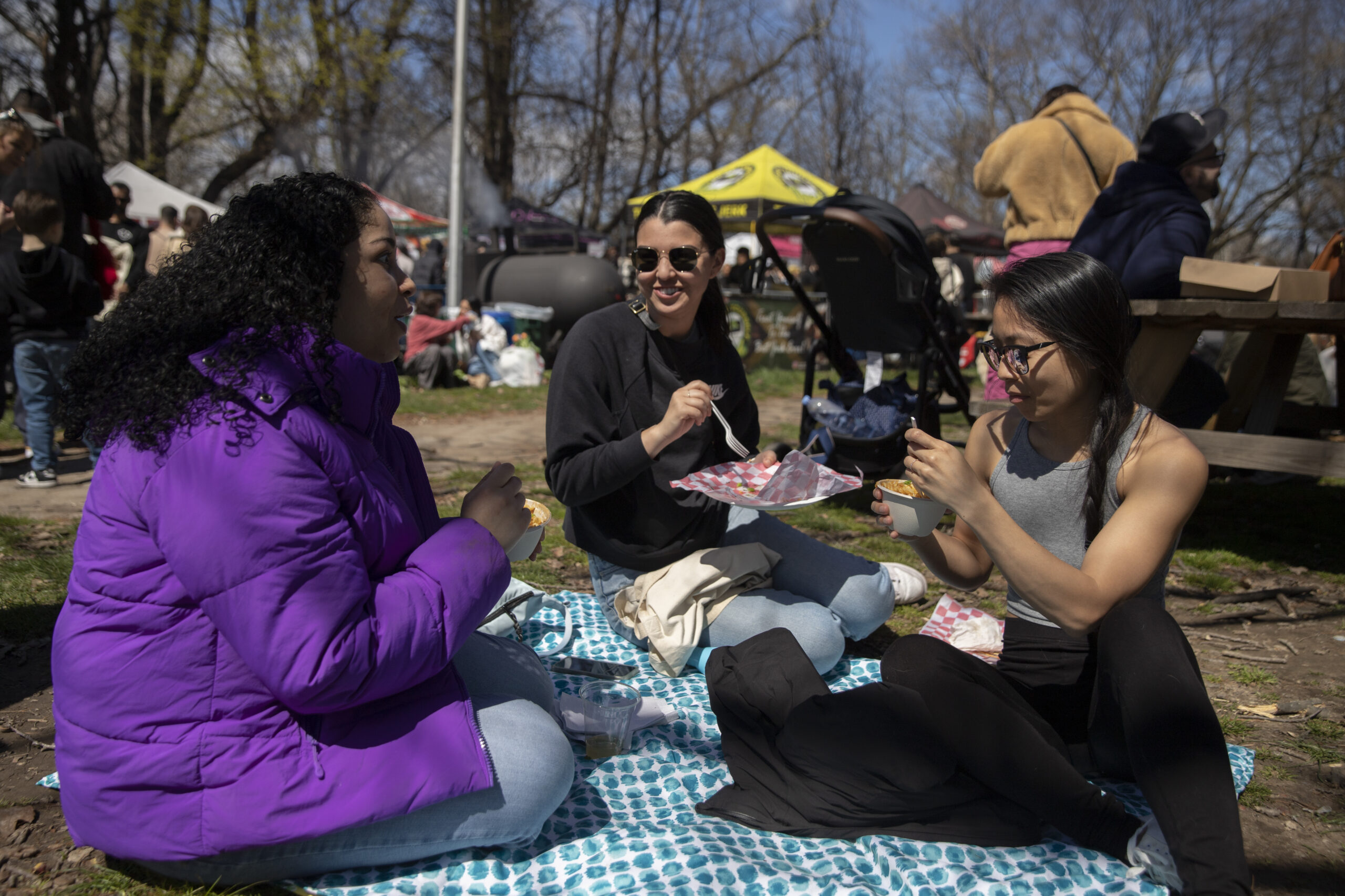 Denisse Diomande, Liana Burns and Kara Ng chat and eat at Prospect Park Smorgasburg.