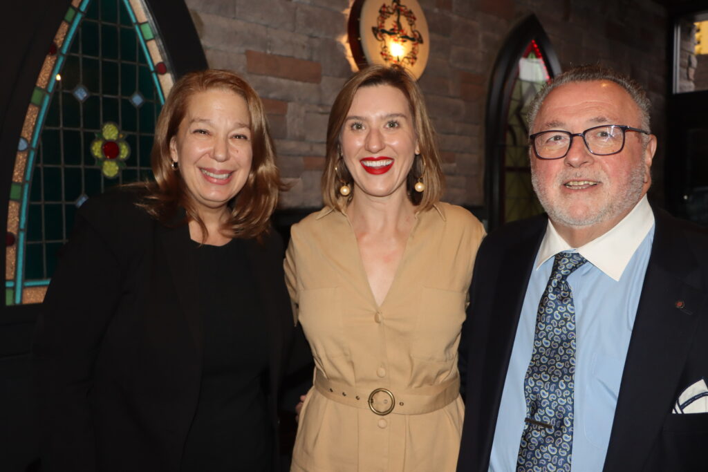 Andrea Bonina (left), a past president of the Brooklyn Bar Association and District Leader Joseph Bova (right) with Alexis Riley (center) at the fundraiser for her campaign to be a Civil Court judge at the Wicked Monk in Bay Ridge on Wednesday, March 27. Brooklyn Eagle photos by Mario Belluomo