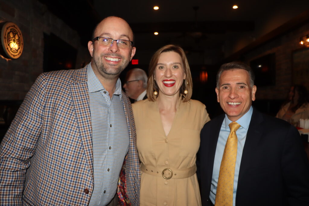 Adam Kalish (left), president of the Bay Ridge Lawyers Association, and Joseph Vasile (right) with Alexis Riley.