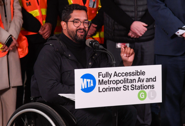 MTA Chief Accessibility Officer Quemuel Arroyo celebrates the new elevators at the Metropolitan Avenue-Lorimer Street subway complex.