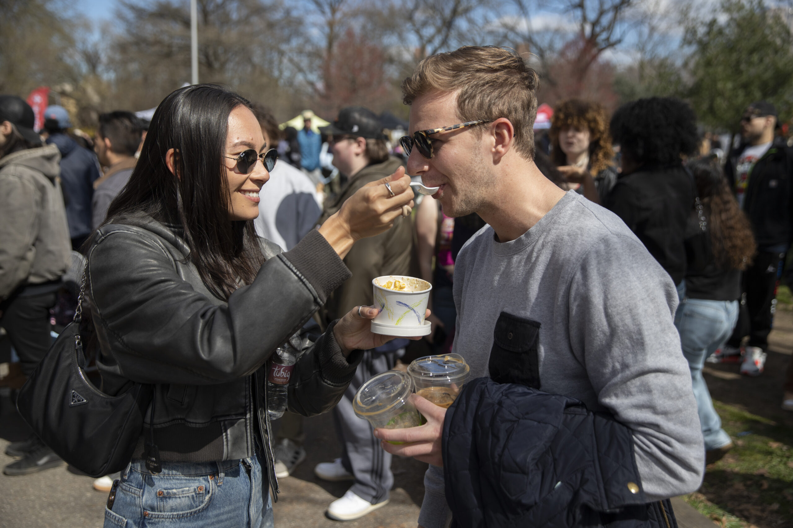 Lianne Yaacoby feeds Alec Schonfeld at Prospect Park Smorgasburg.