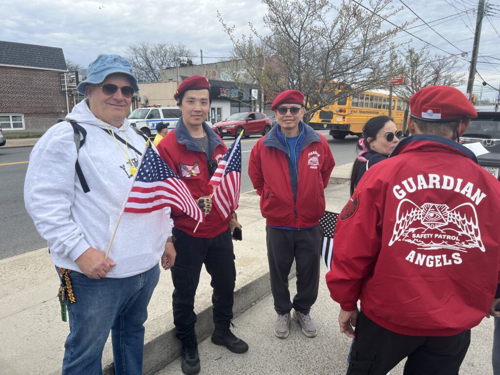 Gregory Rodolico alongside members of the Guardian Angels.