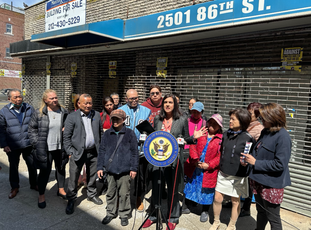 Rep. Nicole Malliotakis (R-11) at the podium, leads community leaders in a rally to block a proposed men’s shelter that she claims would be built at taxpayers’ expense. Photo courtesy of Rep. Nicole Malliotakis