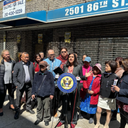 Rep. Nicole Malliotakis (R-11) at the podium, leads community leaders in a rally to block a proposed men’s shelter that she claims would be built at taxpayers’ expense. Photo courtesy of Rep. Nicole Malliotakis