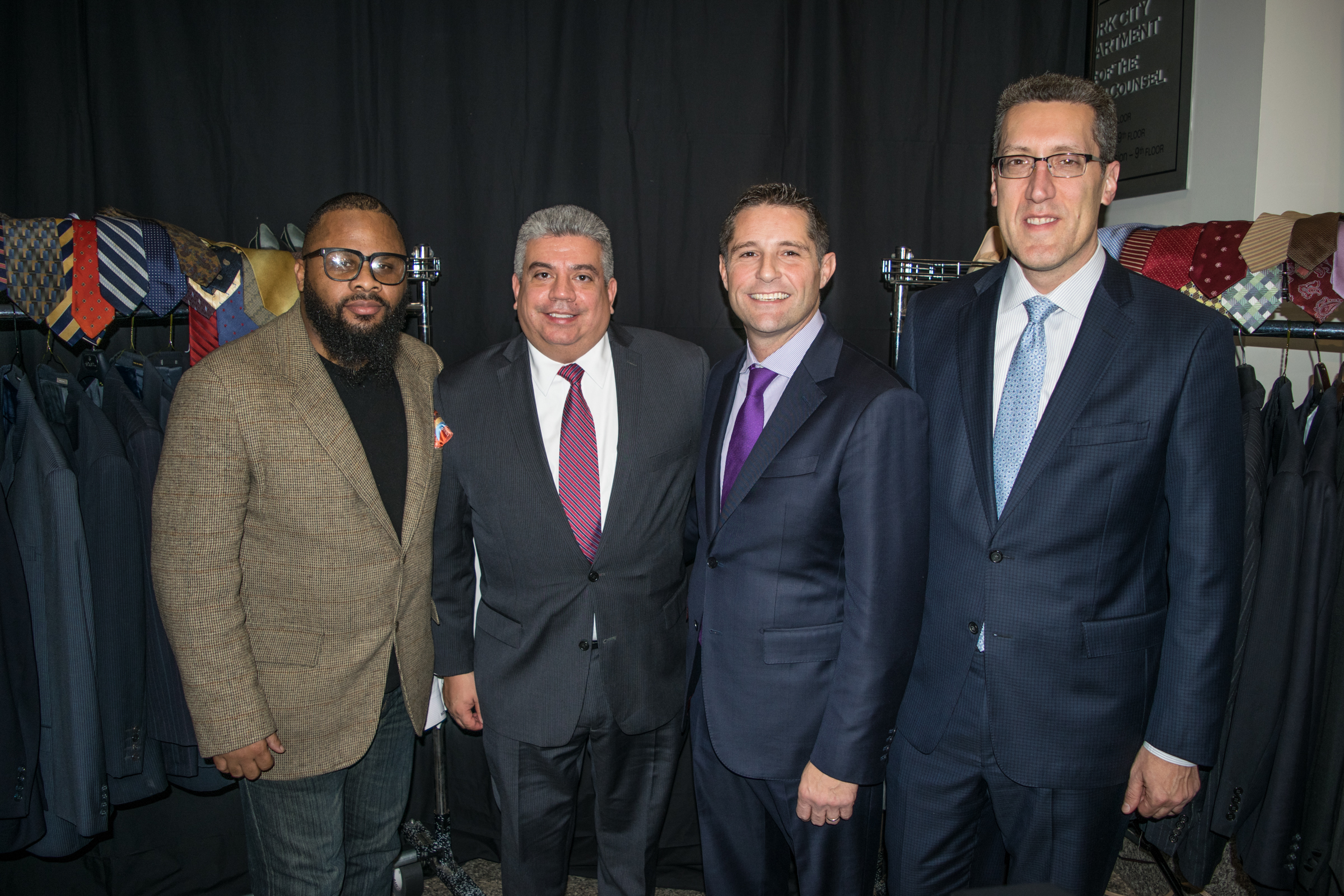 Michael Farkas (right) and District Attorney Eric Gonzalez (second from left) held a similar suit drive in 2017 (here, they are pictured with Kevin Livingston from 100 Suits for 100 Men and Michael Cibella). Brooklyn Eagle photo by Robert Abruzzese