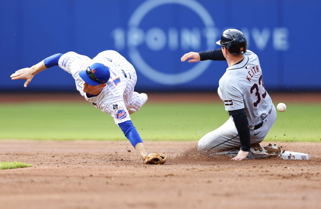 Detroit Tigers Colt Keith (33) steals second base as New York Mets shortstop Joey Wendle, left, is unable to handle the throw during the second inning in the second baseball game of a doubleheader, Thursday, April 4, 2024, in New York. (AP Photo/Noah K. Murray)