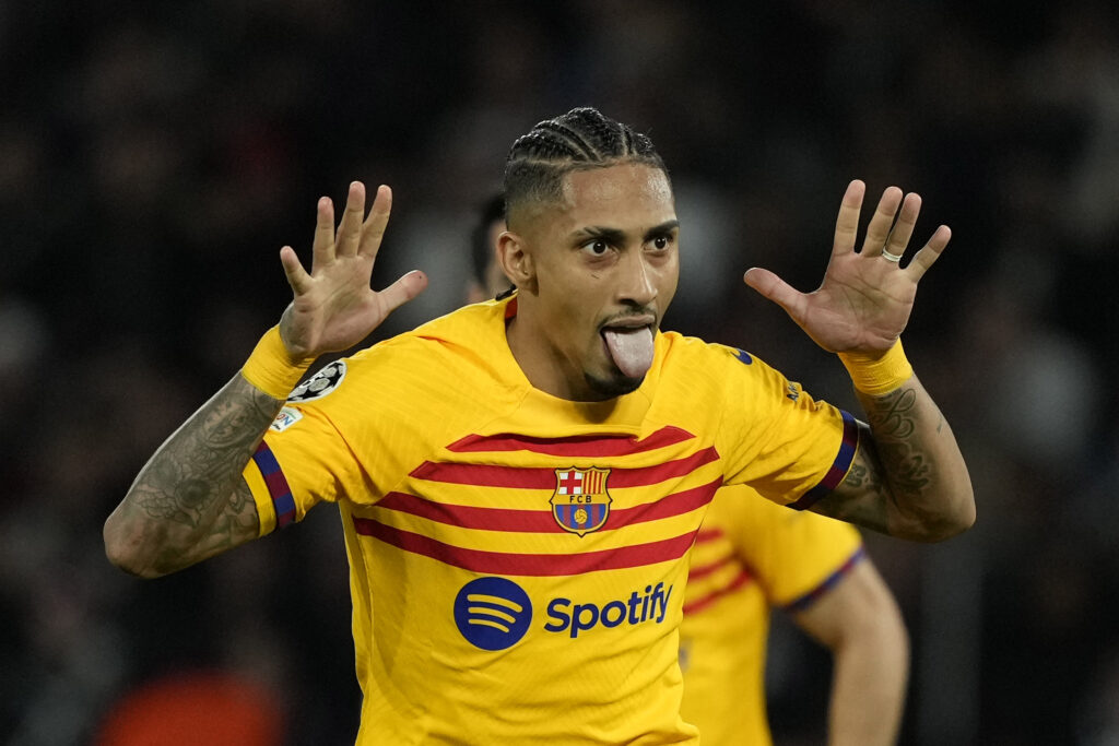 Barcelona's Raphinha celebrates after scoring his side's opening goal during the Champions League quarterfinal first leg soccer match between Paris Saint-Germain and Barcelona at the Parc des Princes stadium in Paris, Wednesday, April 10, 2024. (AP Photo/Lewis Joly)