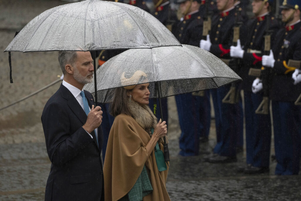 Spain's King Felipe VI and Queen Letizia observe a minute of silence during a wreath laying ceremony at the National Monument opposite the Royal Palace in Amsterdam, Netherlands, Wednesday, April 17, 2024. (AP Photo/Peter Dejong)