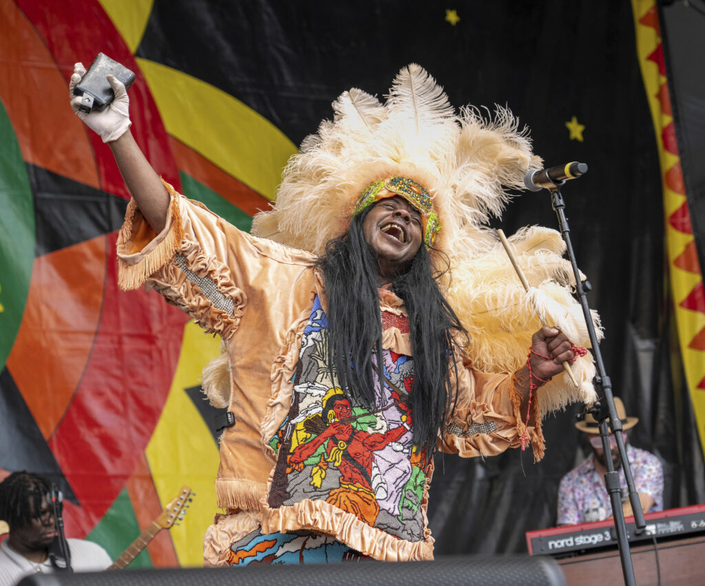 Honey Bannister of the Golden Sioux Mardi Gras Indians performs with Cha Wa during the New Orleans Jazz & Heritage Festival on Thursday, April 25, 2024, at the Fair Grounds Race Course in New Orleans. (Photo by Amy Harris/Invision/AP)