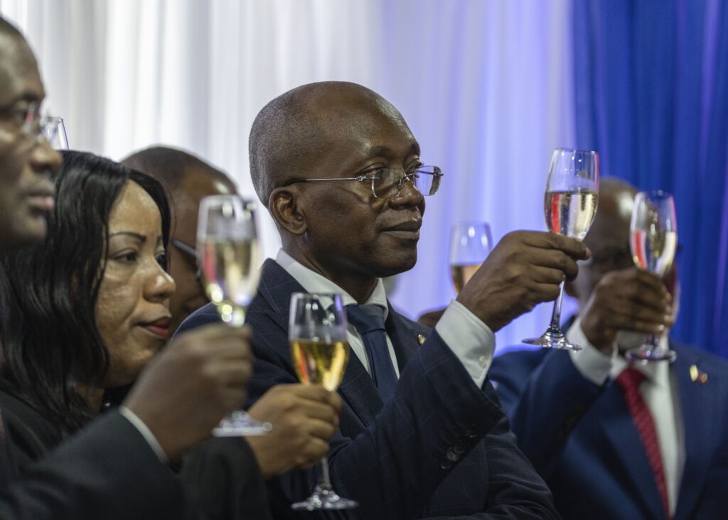 Michel Patrick Boisvert, who was named interim prime minister by the cabinet of outgoing Prime Minister Ariel Henry, toasts during the swearing-in ceremony of the transitional council tasked with selecting Haiti's new prime minister and cabinet, in Port-au-Prince, Haiti, Thursday, April 25, 2024. Boisvert was previously the economy and finance minister. (AP Photo/Ramon Espinosa)