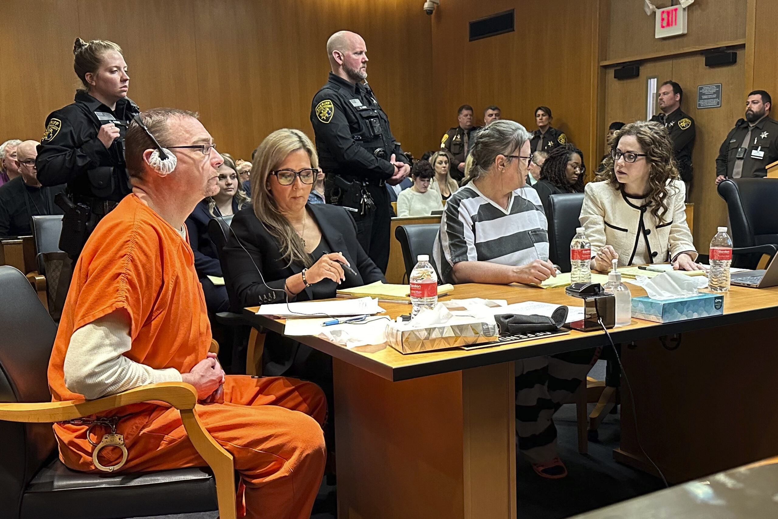 From left, James Crumbley, defense lawyer Mariell Lehman, Jennifer Crumbley, and defense lawyer Shannon Smith await sentencing in Oakland County, Mich., court on Tuesday, April 9, 2024. Photo: Ed White/AP