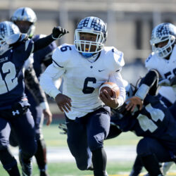 Fort Hamilton Tigers Troy Booker #6 breaks through the line on a first half touchdown run against the Lincoln Railsplitters during a high school football game on Saturday, November 21, 2015 in Brooklyn, NY. Fort Hamilton won and advance in the PSAL playoffs. (AP Photo/Gregory Payan)