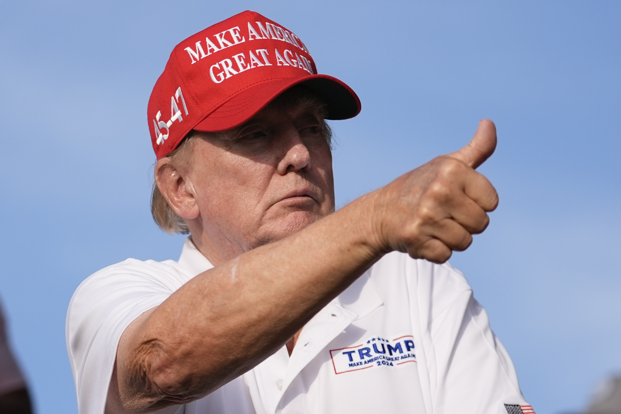 Republican presidential candidate former President Donald Trump gives a thumbs up as he watches play on the 18th hole green during the final round of LIV Golf Miami. Photo: Rebecca Blackwell/AP