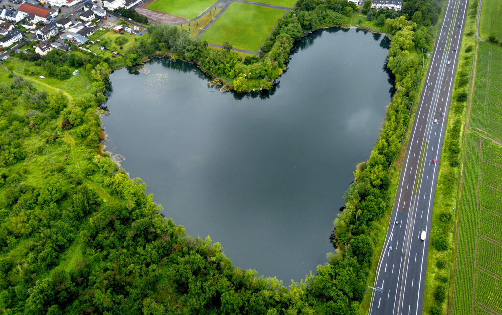 An areal view of the lake in the form of a heart in Rodgau, near Frankfurt, Germany, Friday, May 24, 2024. (AP Photo/Michael Probst)