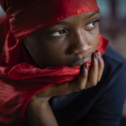 A girl looks on in the family home of the late Ousmane Sylla ahead of his body's arrival in Conakry, Guinea, Monday, April 8, 2024. (AP Photo/Misper Apawu)