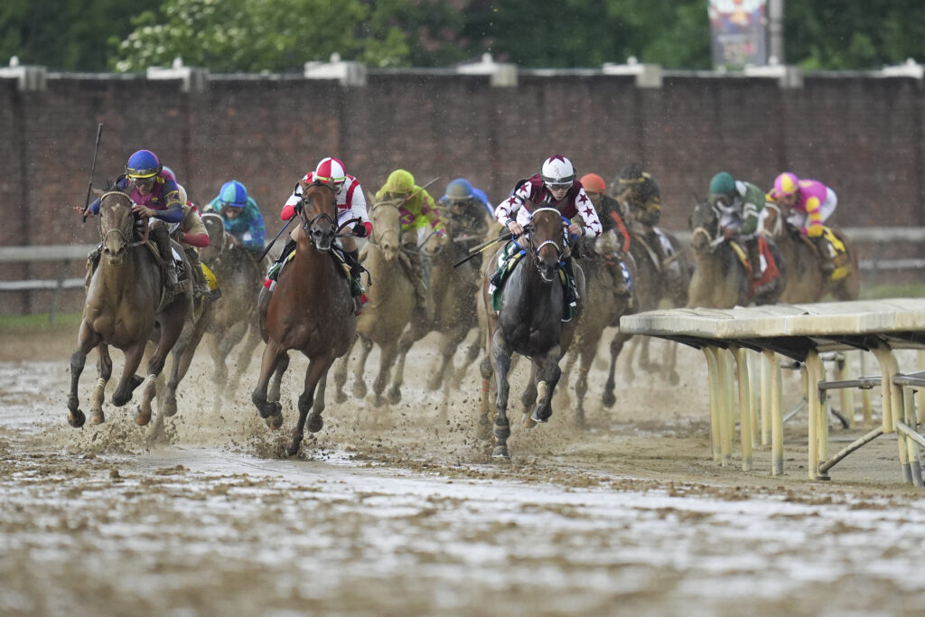 Brian Hernandez Jr. rides Thorpedo Anna, right, to win he 150th running of Kentucky Oaks horse race at Churchill Downs Friday, May 3, 2024, in Louisville, Ky. (AP Photo/Abbie Parr)