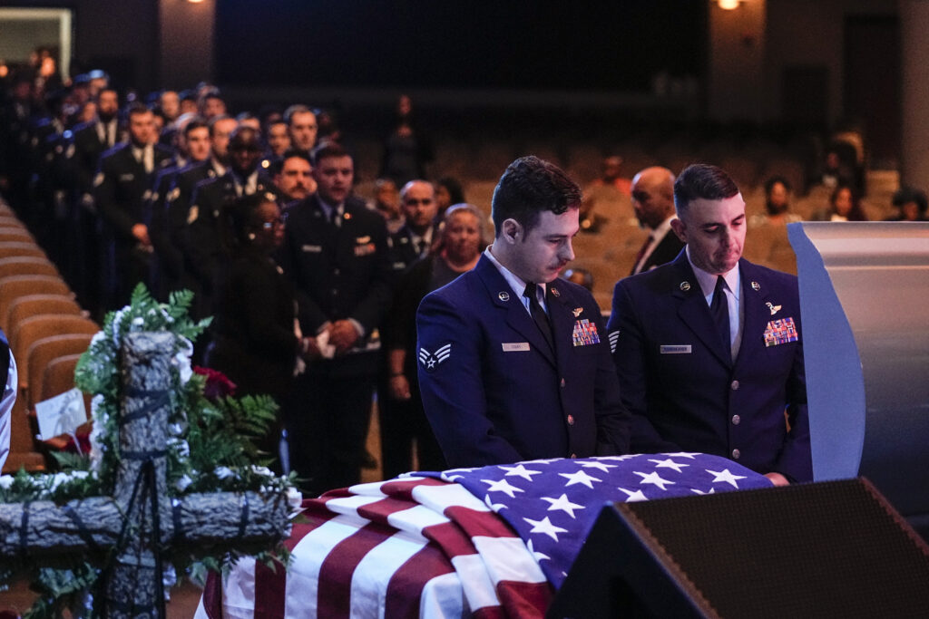 U.S. Air Force personel stand near the coffin of slain airman Roger Fortson during his funeral at New Birth Missionary Baptist Church, Friday, May 17, 2024, near Atlanta. (AP Photo/Brynn Anderson)