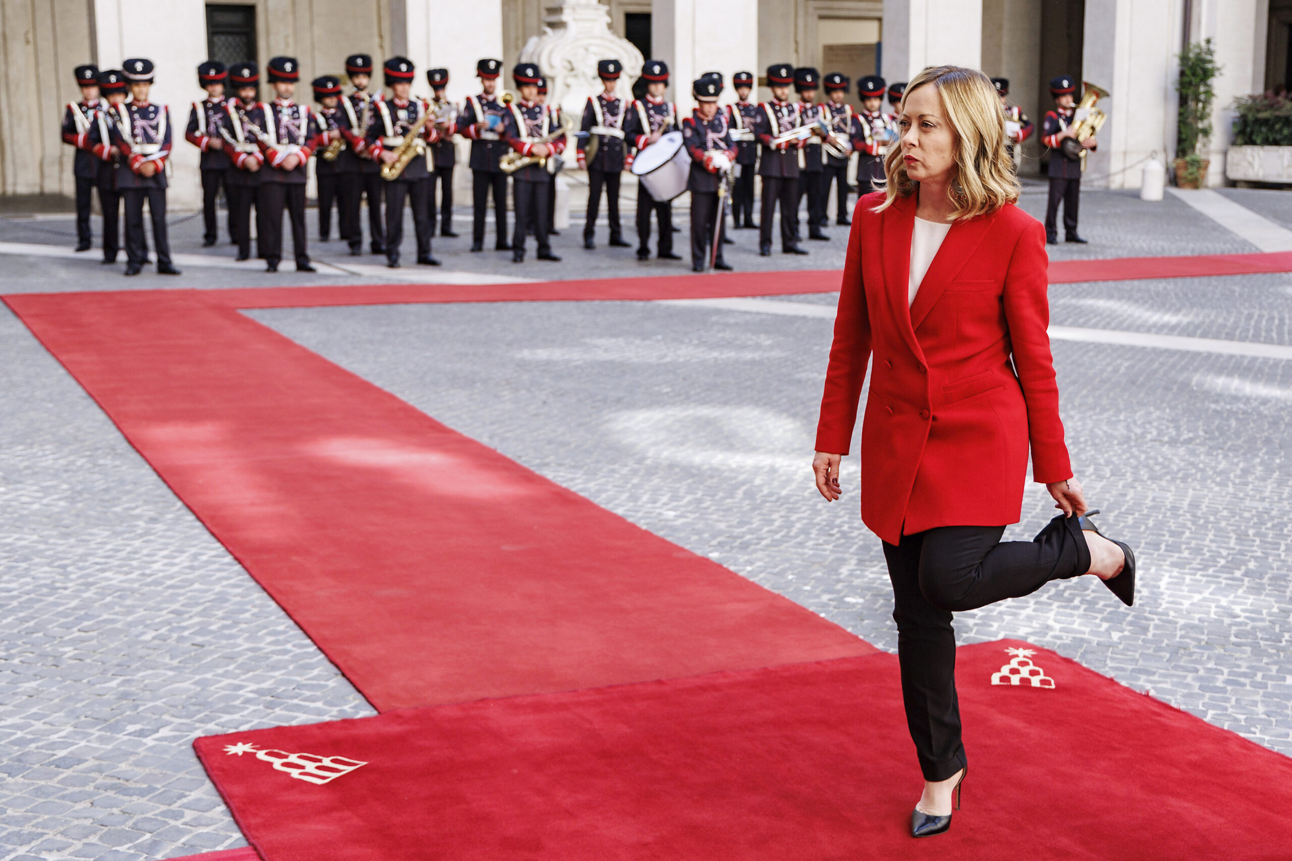 Italian Premier Giorgia Meloni adjusts her trousers ahead of her meeting with Czech Republic's Prime Minister Petr Fiala, at Palazzo Chigi's premier office in Rome, Monday, May 13, 2024. (Roberto Monaldo/LaPresse via AP)
