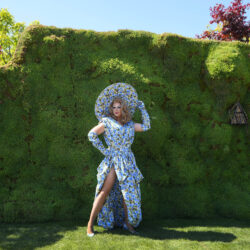 Tom Leonard, the Drag Queen Gardener, poses for a picture at the Chelsea Flower Show in London, Monday, May 20, 2024. The RHS Chelsea Flower Show, is the place to see cutting-edge garden design, new plants and find ideas to take home. It is an event which draws a truly global crowd and is the 'haute-couture' of the international gardening scene. (AP Photo/Kirsty Wigglesworth)