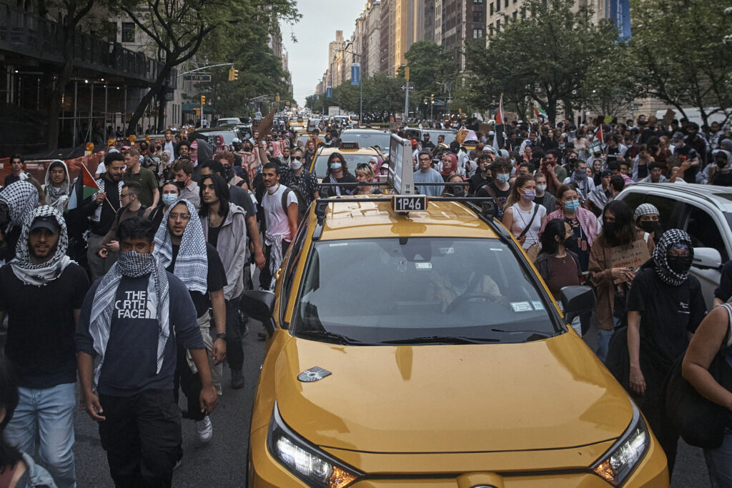 Pro-Palestinian protesters march in between traffic near the Metropolitan Museum of Art, where the Met Gala takes place, Monday, May 6, 2024, in New York. (AP Photo/Andres Kudacki)