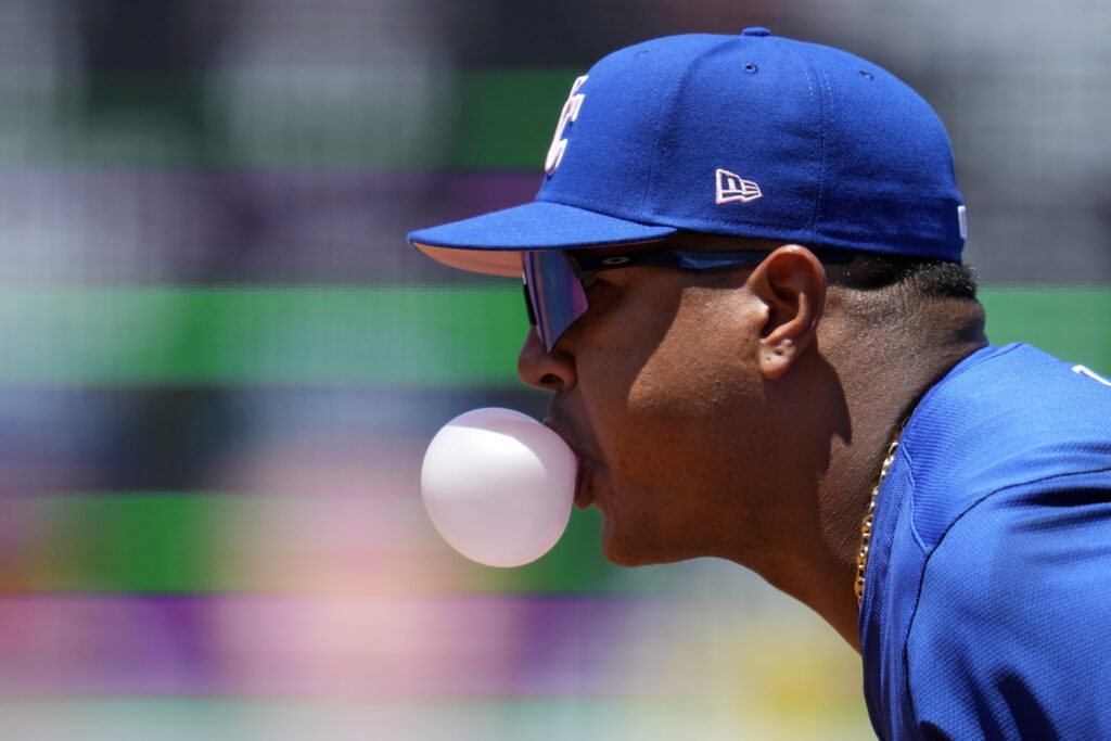 Kansas City Royals first baseman Salvador Perez blows a bubble during the second inning of a baseball game against the Los Angeles Angels Sunday, May 12, 2024, in Anaheim, Calif. (AP Photo/Ashley Landis)