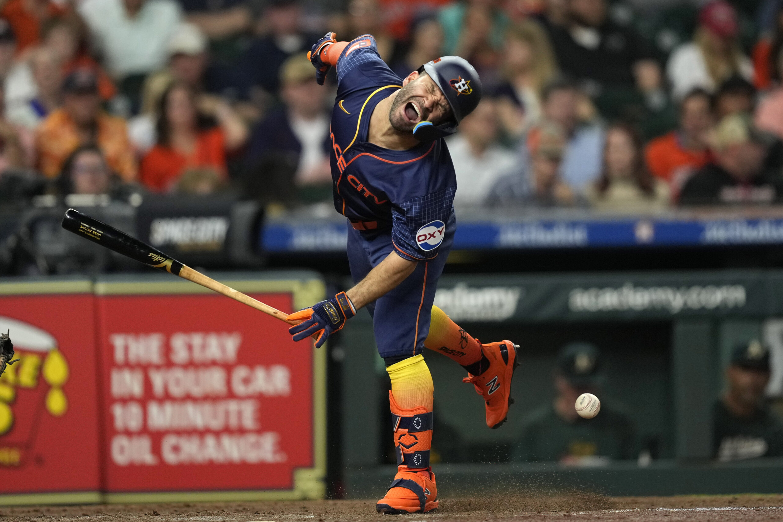 Houston Astros' Jose Altuve reacts after being hit by a pitch thrown by Oakland Athletics starting pitcher Ross Stripling during the third inning of a baseball game Monday, May 13, 2024, in Houston. (AP Photo/David J. Phillip)