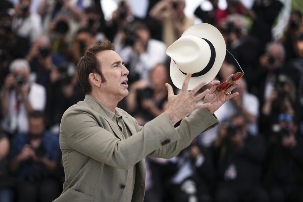 Nicolas Cage poses for photographers at the photo call for the film 'The Surfer' at the 77th international film festival, Cannes, southern France, Friday, May 17, 2024. (Photo by Daniel Cole/Invision/AP)