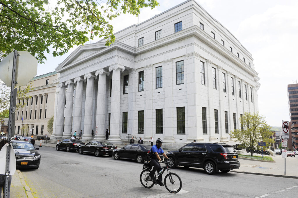 A Police cyclist rides past the New York Court of Appeals, May 5, 2015, in Albany, N.Y.