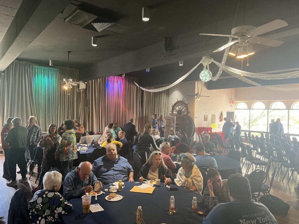 Miramar members eating and socializing at the club’s annual commissioning day Sunday. Photo by Wayne Daren Schneiderman