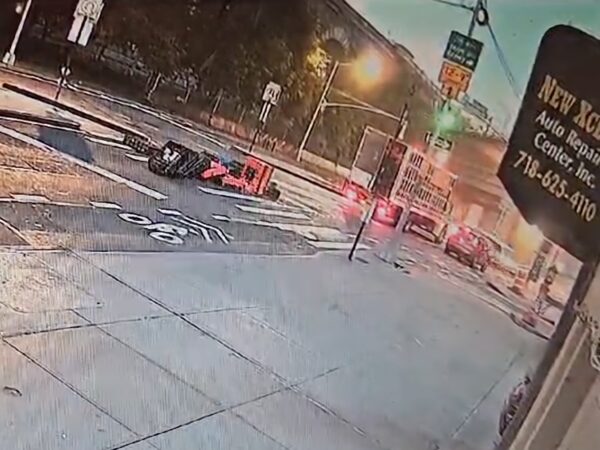 This screen grab captured from surveillance video supplied by Eric Han shows the poultry truck driving away Monday morning, the driver unaware that crates of live chickens were laying in the middle of Old Fulton Street.