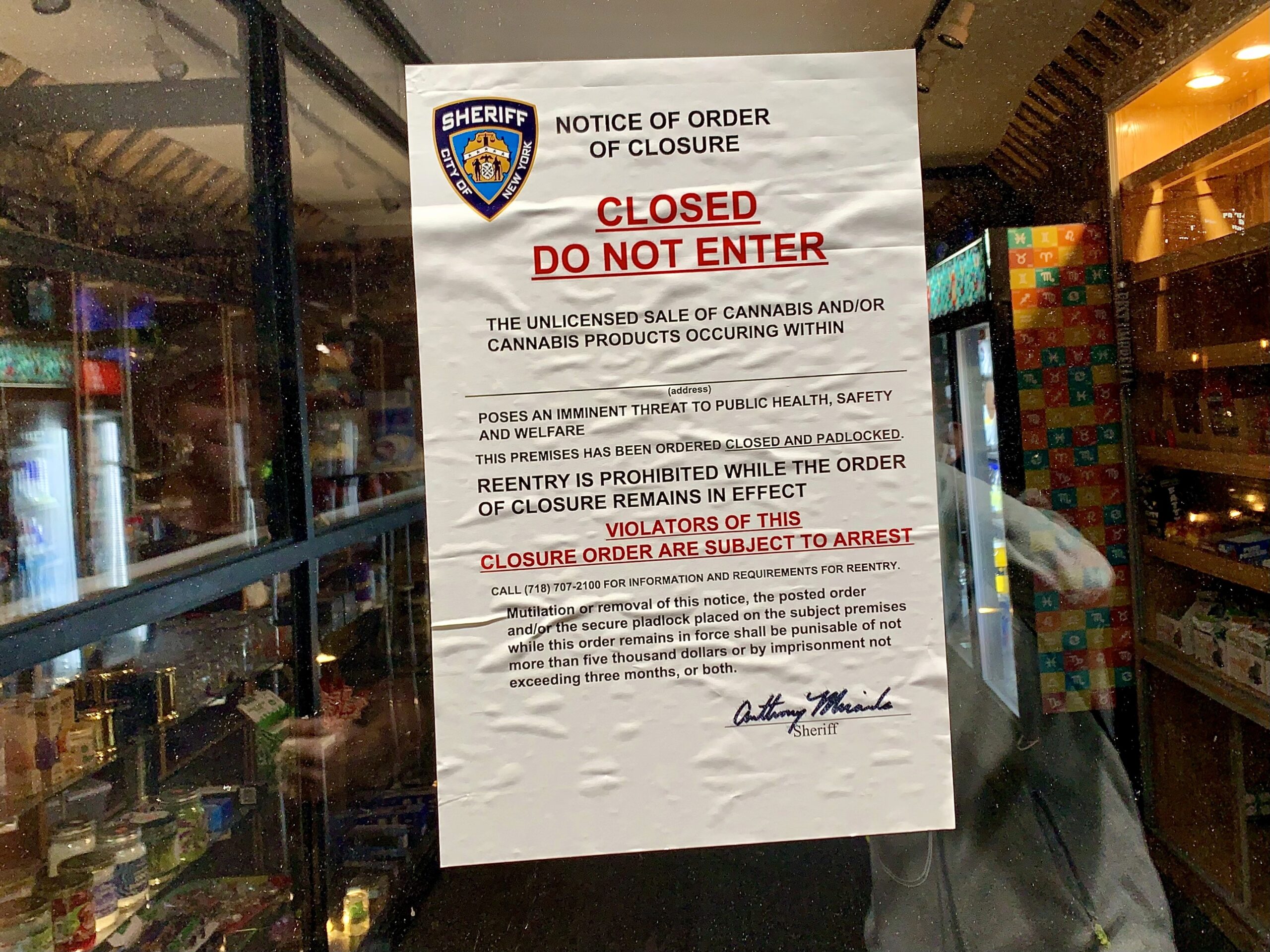 One of the signs posted by the NYC Sheriff on the door of the Exotic Smoke Shop (AKA Convenience and Organic Corporation) at 64 Henry St.
