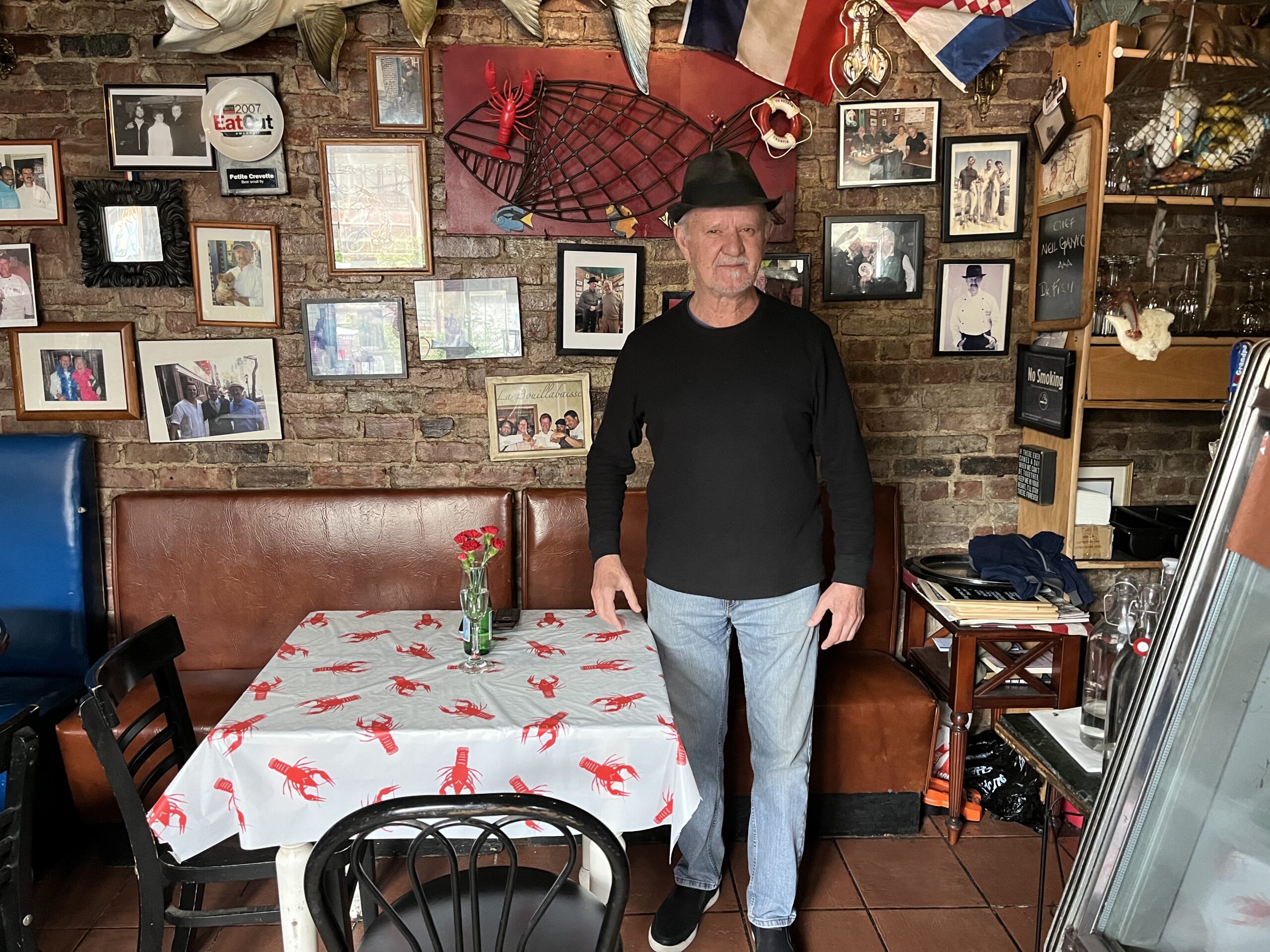 Neil Ganic, owner of Petite Crevette, with signature hat. Photos by Alice Gilbert