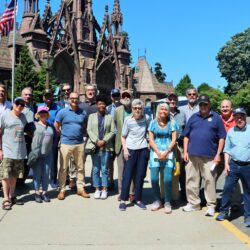 Members of the Brooklyn Bar Association gather for a group photo in front of Green-Wood Cemetery during the "Battle of Brooklyn Trolley Tour," held on May 22, 2024. The tour, led by historian Jeff Richman and author Barnet Schecter, explored the Revolutionary War battlefield and highlighted the rich military history of Brooklyn.