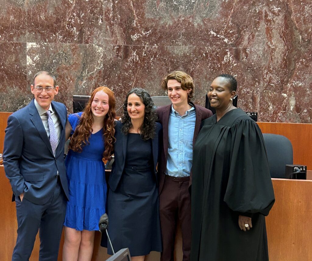Hon. Lara Eshkenazi (center) poses with Chief Judge Margo Brodie (right) and her family after being sworn in as a magistrate judge for the Eastern District of New York. Photos courtesy of the U.S. District Court for the Eastern District of New York